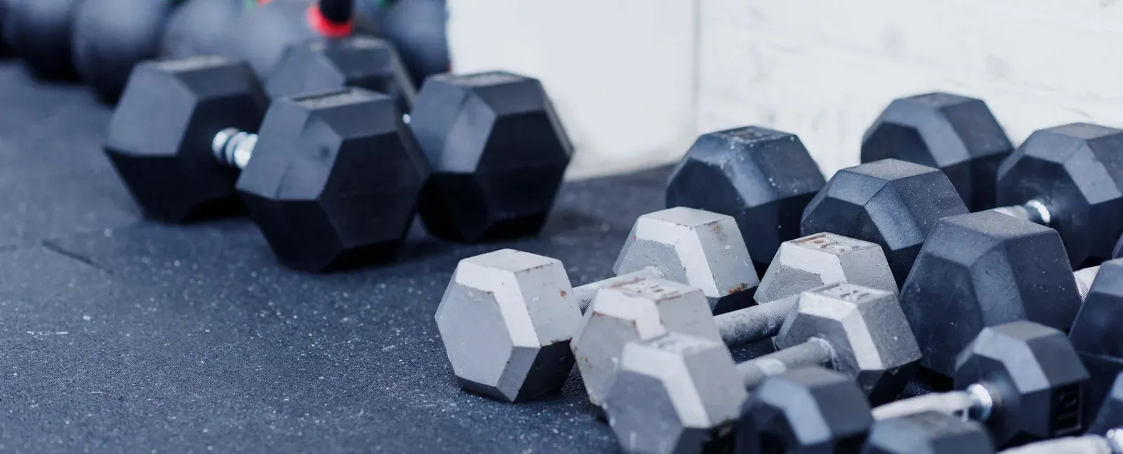 A rack of dumbbells set up for a bodybuilding session at Test Gym